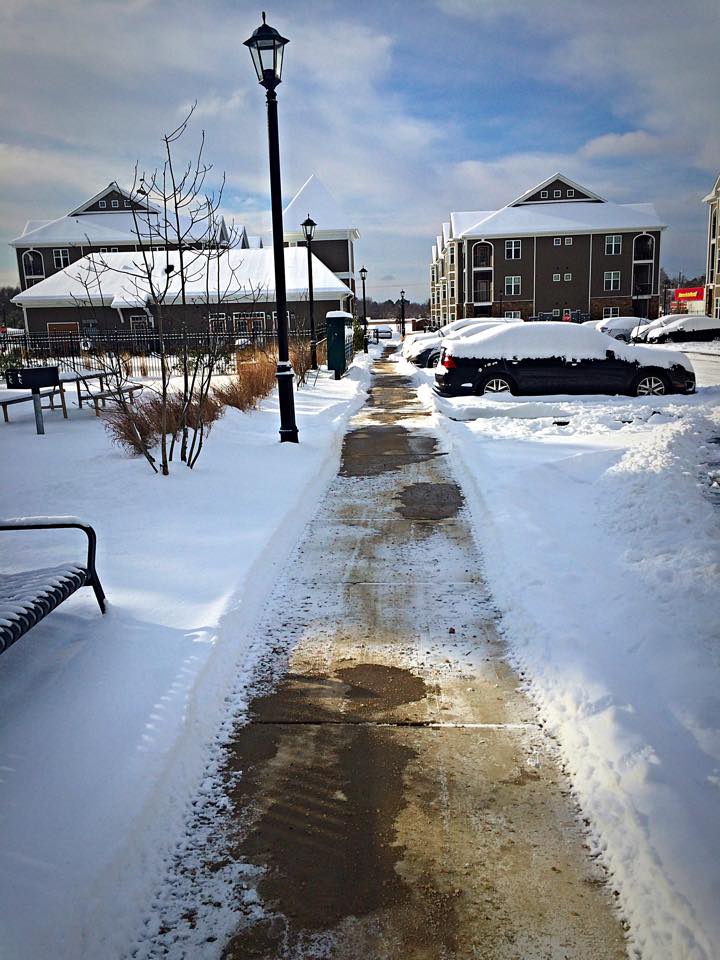 sidewalk clear of snow on a sunny day