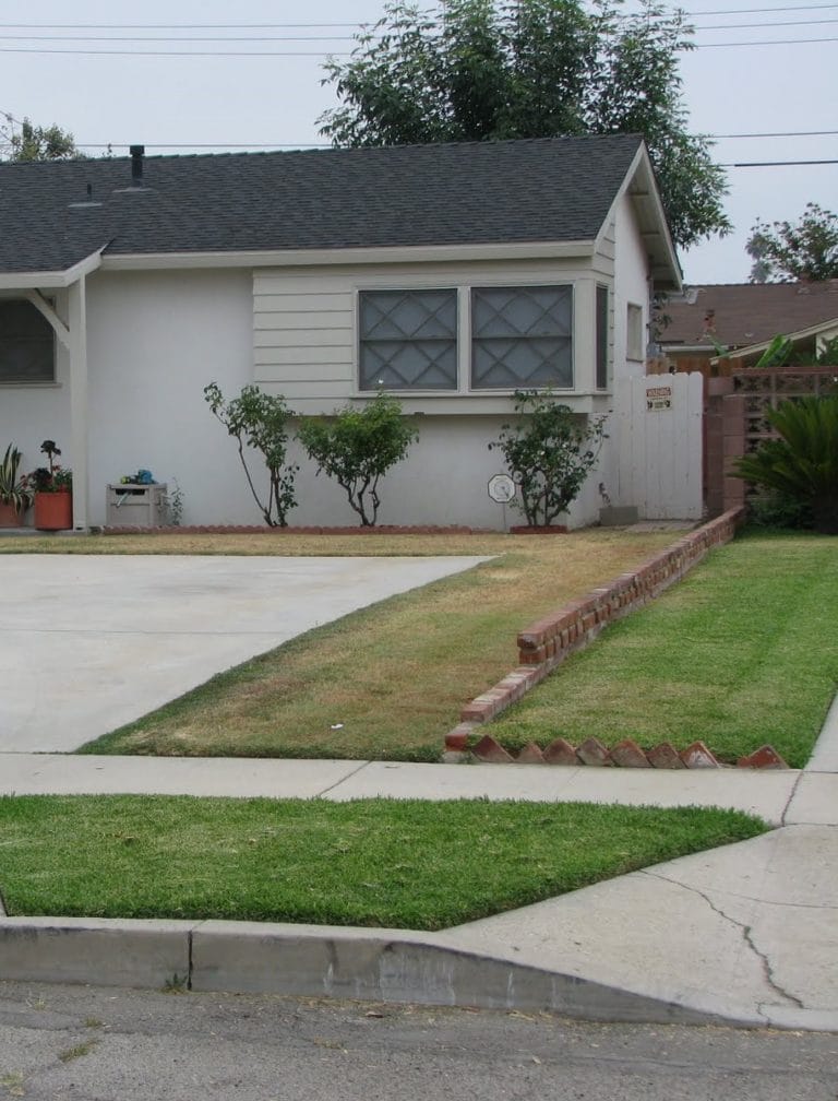 Suburban house with neat lawn and driveway