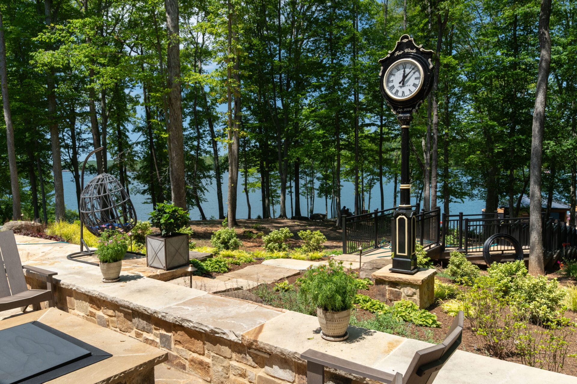 Lakeside patio with clock and hanging chair